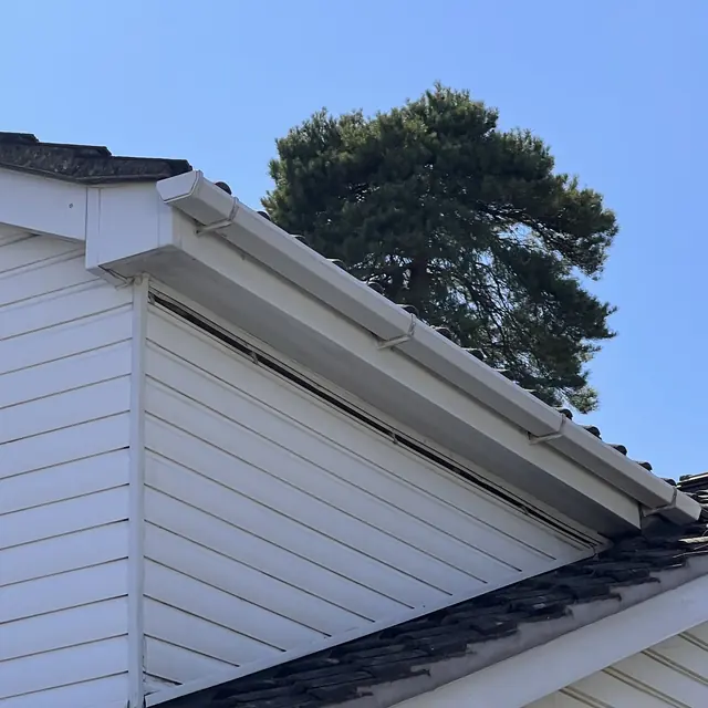 New white uPVC soffits, fascias and gutter on a house with white cladding